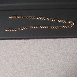 New 14 karat gold man's Figaro bracelet